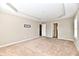 Empty bedroom with tray ceiling, neutral walls, and spacious closet at 18726 Tillamook E Run, Noblesville, IN 46062