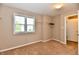 Bright bedroom featuring a window, carpet, and closet with wire shelving at 18726 Tillamook E Run, Noblesville, IN 46062