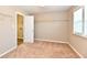 Well-lit bedroom featuring a window, carpet, and closet with wire shelving at 18726 Tillamook E Run, Noblesville, IN 46062
