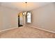 Open dining room area with a chandelier and an entrance to another room at 18726 Tillamook E Run, Noblesville, IN 46062