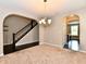 Spacious dining room with a view of the staircase and an adjacent kitchen at 18726 Tillamook E Run, Noblesville, IN 46062
