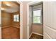 Hallway leading to a bedroom with a walk-in closet and a closet with a window at 18726 Tillamook E Run, Noblesville, IN 46062