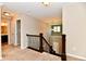 Carpeted upstairs hallway featuring views of staircase and access to other rooms at 18726 Tillamook E Run, Noblesville, IN 46062