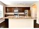 Modern kitchen with stainless steel appliances, custom cabinetry and large island at 18726 Tillamook E Run, Noblesville, IN 46062