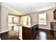 Open floorplan kitchen with granite countertops and stainless steel appliances at 18726 Tillamook E Run, Noblesville, IN 46062