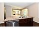 Kitchen island featuring a stainless steel dishwasher and granite countertop at 18726 Tillamook E Run, Noblesville, IN 46062