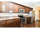 Modern kitchen featuring dark wood cabinets, stainless steel appliances, and a countertop at 18726 Tillamook E Run, Noblesville, IN 46062