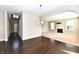Spacious layout featuring hardwood floors and neutral paint tones connects living and dining spaces at 18726 Tillamook E Run, Noblesville, IN 46062