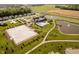Stunning aerial view of the community featuring a pool, ponds, clubhouse, volleyball court, and green spaces at 19581 Sumrall Pl, Westfield, IN 46074