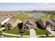 Overhead view highlighting the manicured lawns, community pond, and the surrounding homes at 19581 Sumrall Pl, Westfield, IN 46074
