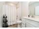 Bright bathroom with modern vanity, sleek fixtures, and a shower-tub combination with a white shower curtain at 19581 Sumrall Pl, Westfield, IN 46074