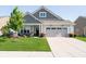 Charming single-Gathering home with manicured lawn, inviting front porch, and a two-car attached garage at 19581 Sumrall Pl, Westfield, IN 46074