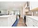 Bright kitchen with quartz countertops, stainless appliances, white cabinetry, and open layout at 19581 Sumrall Pl, Westfield, IN 46074