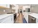 Modern kitchen with quartz countertops, stainless appliances, white cabinetry, and tile backsplash at 19581 Sumrall Pl, Westfield, IN 46074