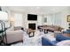 Bright living room featuring a modern fireplace, a plush rug, and stylish, comfortable seating at 19581 Sumrall Pl, Westfield, IN 46074