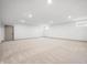 Unfinished basement space with neutral carpet and lighting, ready for customization at 19987 Old Dock Rd, Westfield, IN 46074