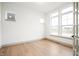 Bright living room featuring hardwood floors and lots of natural light through large windows at 19987 Old Dock Rd, Westfield, IN 46074