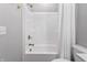 Bathroom featuring a white tub-shower, bronze fixtures, and sleek design, offering a comfortable and functional space at 2223 Ryder Pl, Westfield, IN 46074