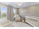 Beautiful Bedroom featuring a crib, changing table, rocking chair, and natural light from two windows at 2223 Ryder Pl, Westfield, IN 46074