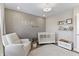 A cozy Bedroom with natural light, a crib, and a comfortable rocking chair, perfect for a new Gathering at 2223 Ryder Pl, Westfield, IN 46074