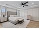 Luxurious bedroom with a king-size bed, tray ceiling, and plenty of natural light, creating a serene retreat at 2223 Ryder Pl, Westfield, IN 46074