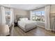 A well-lit bedroom featuring a plush bed, large window, and desk for a comfortable and stylish space at 2223 Ryder Pl, Westfield, IN 46074