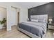 Well-appointed bedroom with a stylish accent wall, plush bedding, and ample natural light, creating a cozy space at 2223 Ryder Pl, Westfield, IN 46074