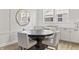 Elegant dining area with modern decor, featuring white chairs and recessed lighting at 2223 Ryder Pl, Westfield, IN 46074