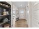 Inviting entryway features wood flooring, a sliding barn door, and decorative shelving, enhancing the home's charm at 2223 Ryder Pl, Westfield, IN 46074