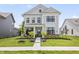 Charming two-story home with black trimmed windows and a well-manicured lawn at 2223 Ryder Pl, Westfield, IN 46074