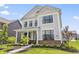 Charming two-story home with well-manicured landscaping, lush green lawn, and inviting curb appeal at 2223 Ryder Pl, Westfield, IN 46074