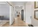 Spacious foyer with wood floors, open doorway to the living room, and a barn door adding character at 2223 Ryder Pl, Westfield, IN 46074