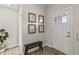 Bright foyer with wood floors, a front door with glass accents, and charming wall decor at 2223 Ryder Pl, Westfield, IN 46074