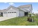 Attached two-car garage provides ample parking and convenient access to the home at 2223 Ryder Pl, Westfield, IN 46074