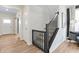 Open hallway with stairs, wood floors, and ample light, connecting different areas of the home seamlessly at 2223 Ryder Pl, Westfield, IN 46074