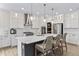Open kitchen with stainless steel appliances, island seating and pendant lighting at 2223 Ryder Pl, Westfield, IN 46074