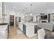 Kitchen boasts an island, pendant lights, stainless steel appliances, and seamless transition to the living area at 2223 Ryder Pl, Westfield, IN 46074