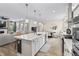 Beautiful open kitchen with large island, pendant lights and open layout to living area at 2223 Ryder Pl, Westfield, IN 46074