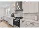 Well-lit kitchen showcasing white cabinets, stainless steel appliances, and a gas range stove at 2223 Ryder Pl, Westfield, IN 46074