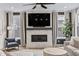 Living room features a modern fireplace, large windows, and comfortable seating at 2223 Ryder Pl, Westfield, IN 46074