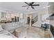 Open-concept living room flows into the kitchen, featuring a cozy gray sectional and modern decor at 2223 Ryder Pl, Westfield, IN 46074