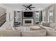Living room features a modern fireplace, large windows, and comfortable seating at 2223 Ryder Pl, Westfield, IN 46074