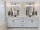 This main bathroom features a double sink vanity, framed mirrors, and a large glass enclosed shower at 2223 Ryder Pl, Westfield, IN 46074