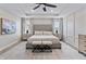 This main bedroom boasts a decorative wall, large rug, and a king bed with an upholstered headboard at 2223 Ryder Pl, Westfield, IN 46074
