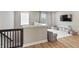 Upstairs landing features a well-lit playroom with toys and media, creating a fun and safe environment at 2223 Ryder Pl, Westfield, IN 46074