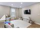 Bright and spacious playroom is equipped with a TV and furniture, perfect for entertainment and relaxation at 2223 Ryder Pl, Westfield, IN 46074