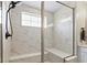 This modern shower features marble tile walls, bench seating, and a sleek, modern shower head at 2223 Ryder Pl, Westfield, IN 46074