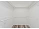 Well-organized closet with ample shelving and rod space, optimizing storage and accessibility at 233 N Devon Ave, Indianapolis, IN 46219