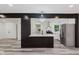 Modern kitchen island with pendant lighting, stainless steel appliances, and open layout at 233 N Devon Ave, Indianapolis, IN 46219