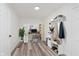 Bright home office with wood floors, work station, and ample storage; perfect for a productive workspace at 233 N Devon Ave, Indianapolis, IN 46219